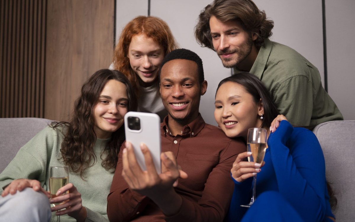 Group of friends laughing and holding phones with the UpSwap app logo displayed.