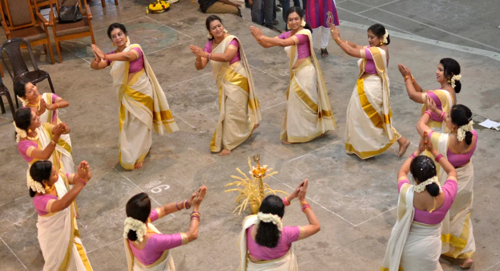 some ladies enjoy when dancing Onam Celebrations