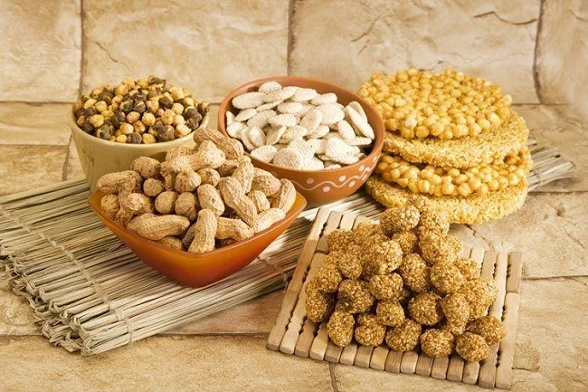 Traditional celebrating Lohri Food (gajak moongfali chana) 
eating at the time period of lohri