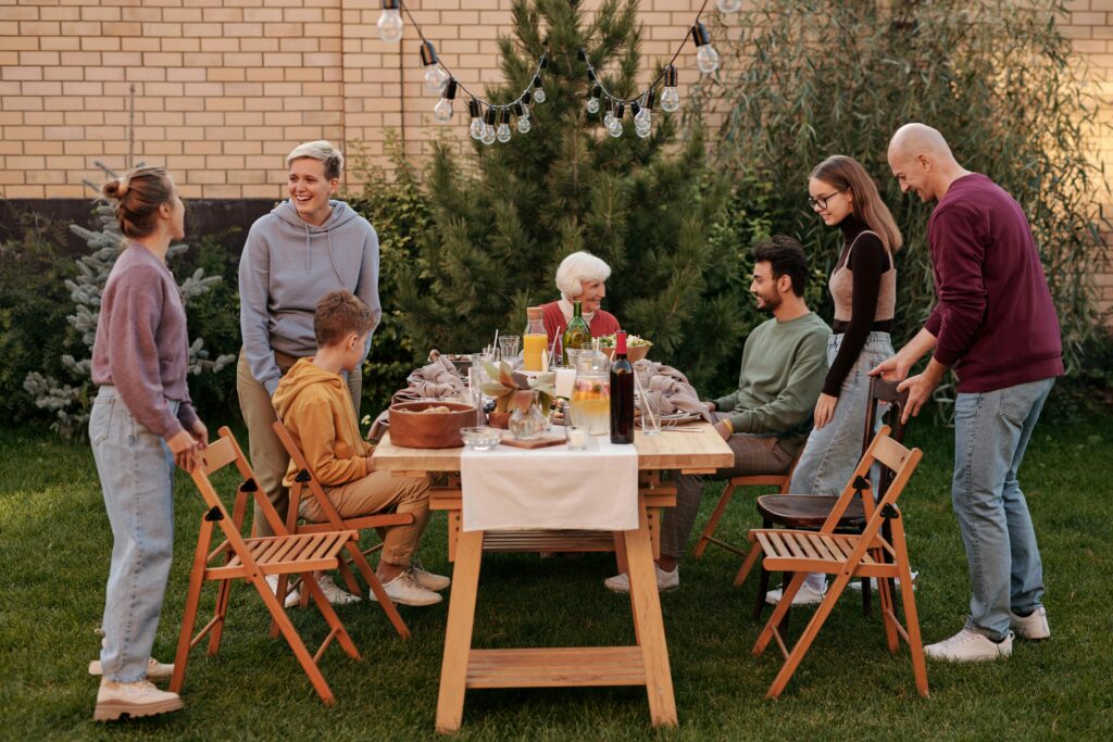 Group of teenagers laughing and crafting together at a table