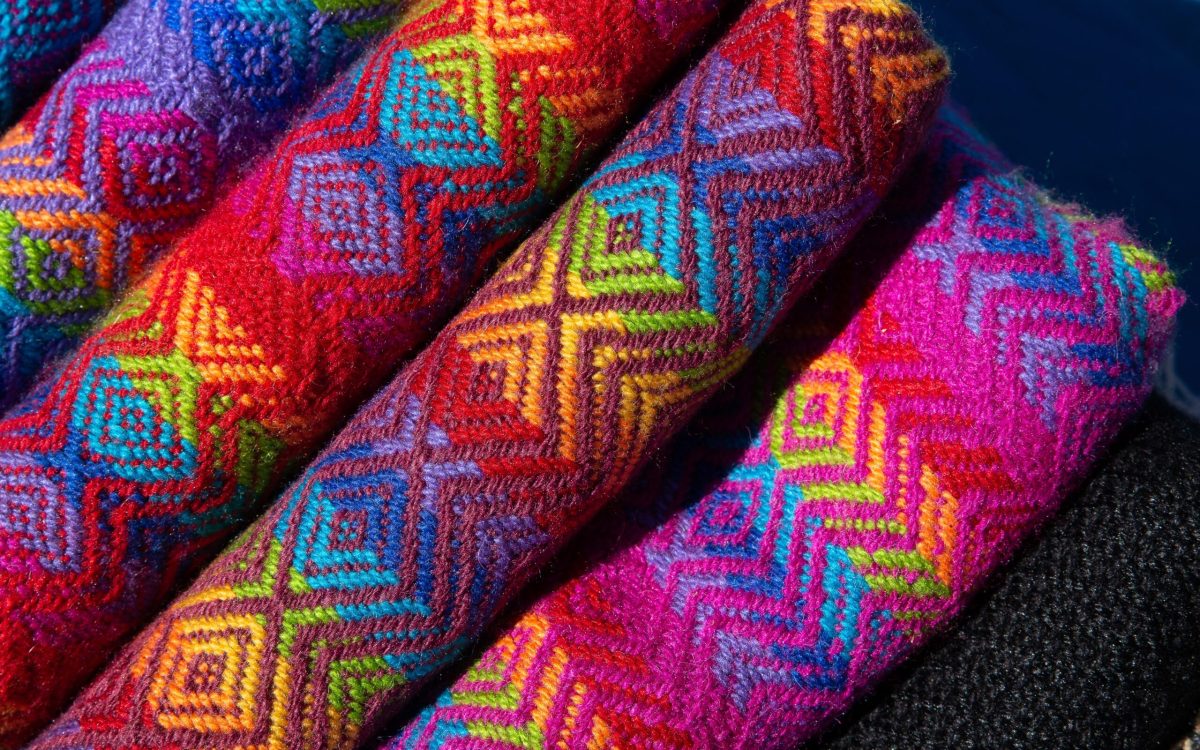 Closeup shot of rolled fabrics with colorful and unique designs