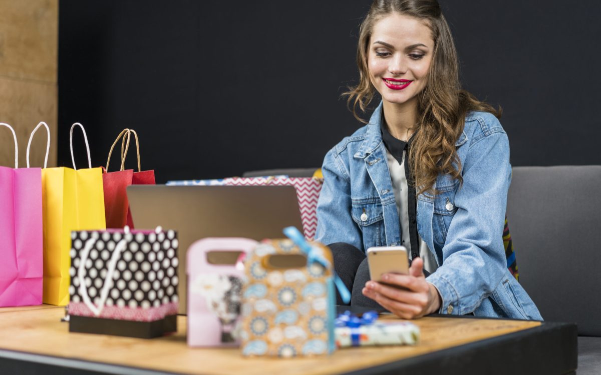 Person using Upswap app on phone while shopping in a store