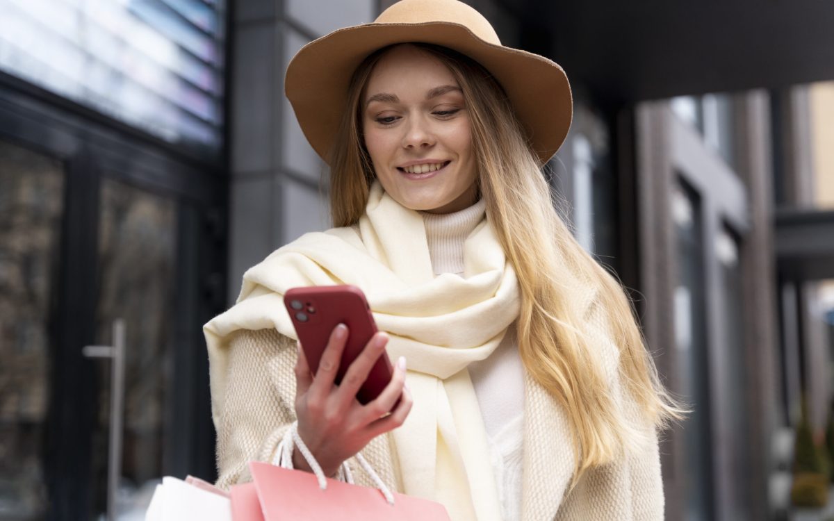 UpSwap app logo with a single person having fun shopping and texting on their phone.